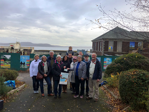 Terry Lambert from Troutbeck Bridge Amateur Swimming Club presents Save Grange Lido with £500